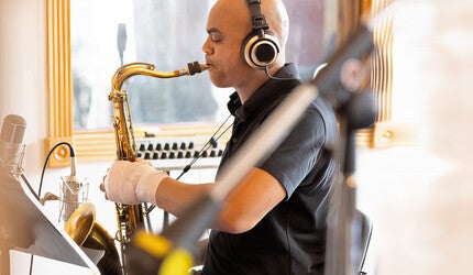 Wayne Escoffery playing tenor saxophone in the recording studio