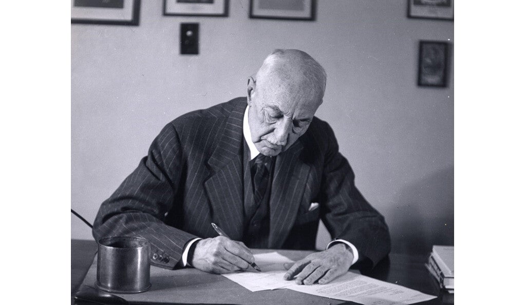 C.-E. A. Winslow working at his desk.