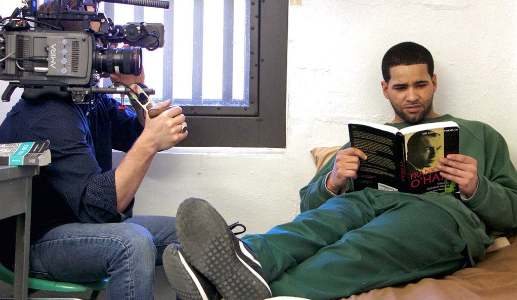 An incarcerated student is filmed reading poems by Frank O’Hara for the documentary “College Behind Bars.” 