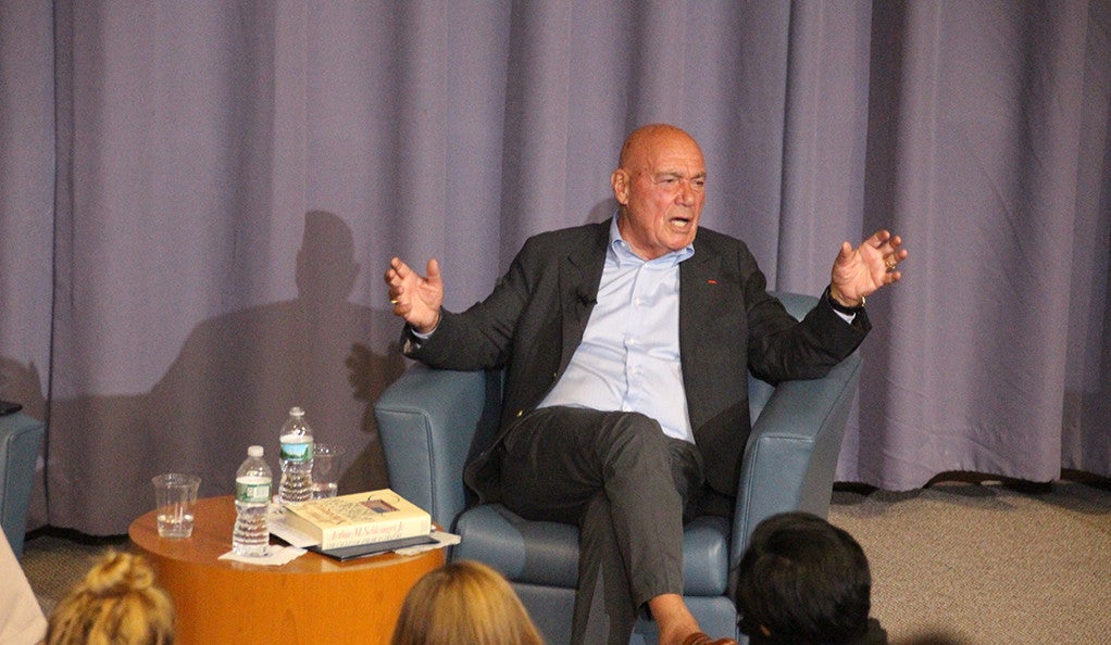 Vladimir Pozner sitting on stage during a question-and-answer session at Luce Hall at Yale. 