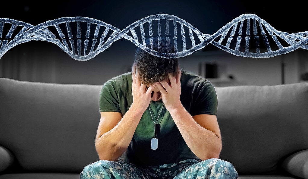 Man with head in his hands with image of DNA helix above him.