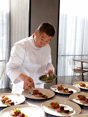 Chef Ren Jinsuo plates a plant-based Lunar New Year dish.