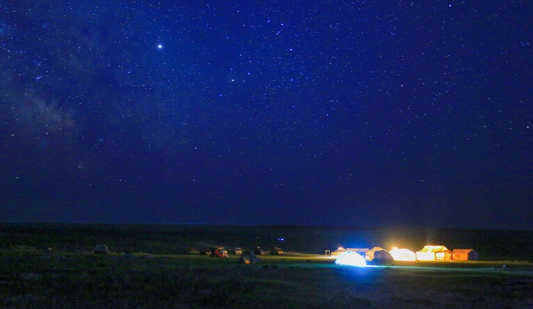 Archaeological camp in eastern Mongolia at night.