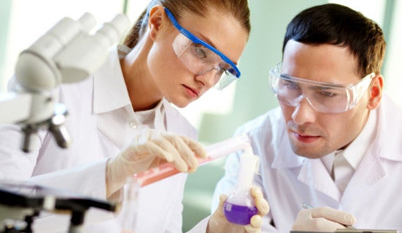 Photo of Lab Students working on an Experiment