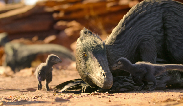 A feathered dinosaur with its young