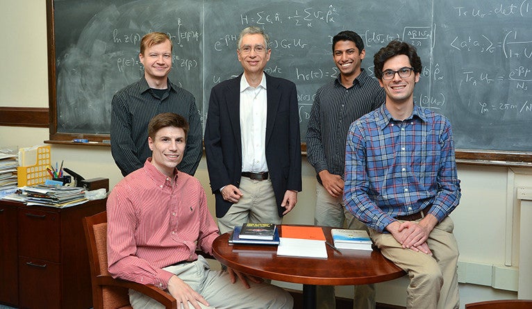 Photo of Professor Yoram Alhassid and four of his research team.