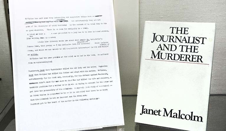 A copy of “The Journalist and the Murderer,” displayed alongside a page of of her notes from her research for the book. 