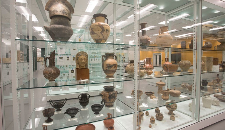 A display of jars and bowls from different cultures