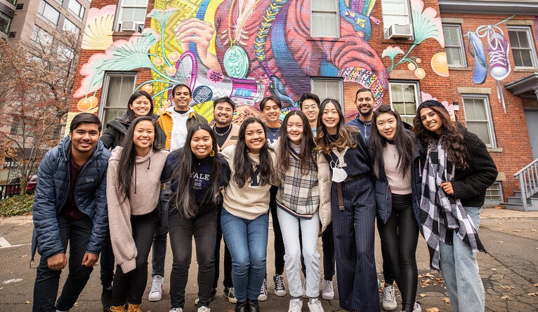 Students in front of mural