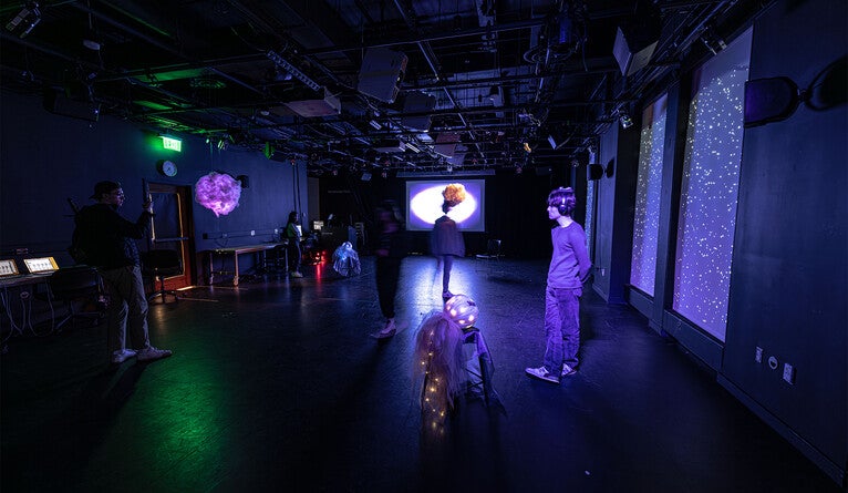 People walking around in the motion capture installation