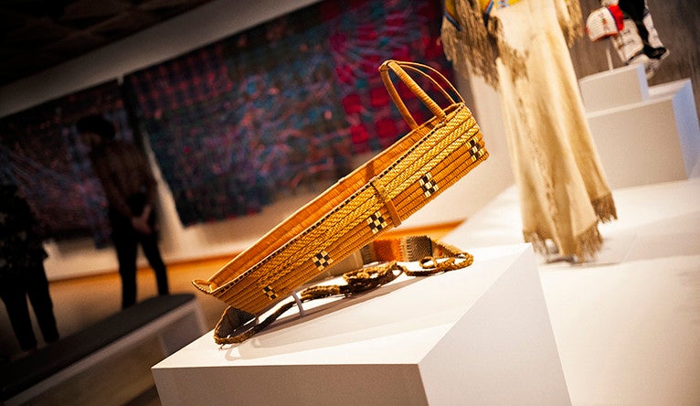 A basket cradle created by an artist once known of the Nlakapamuk